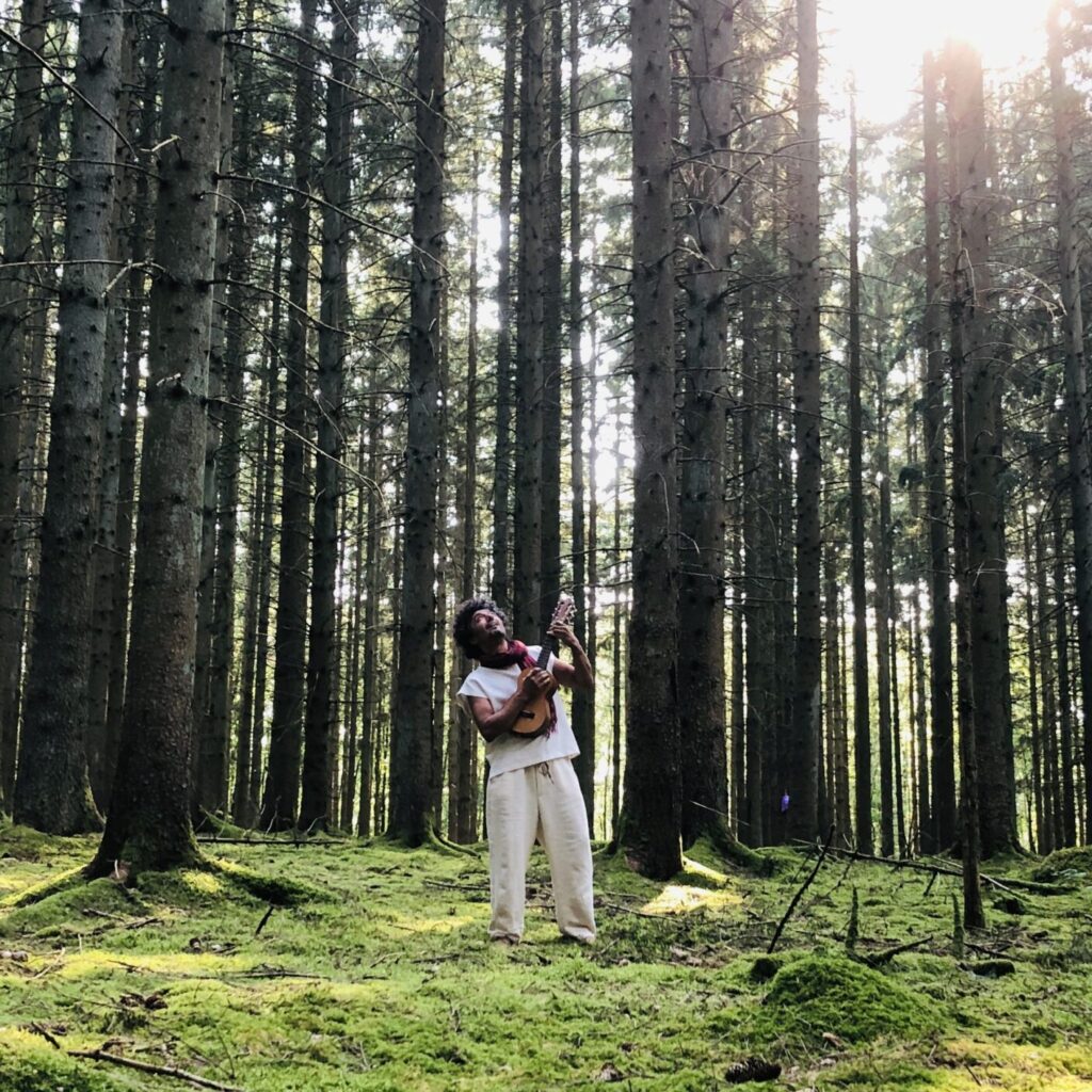Sound of Silence. Om Shira playing guitar in a fairytale forrest